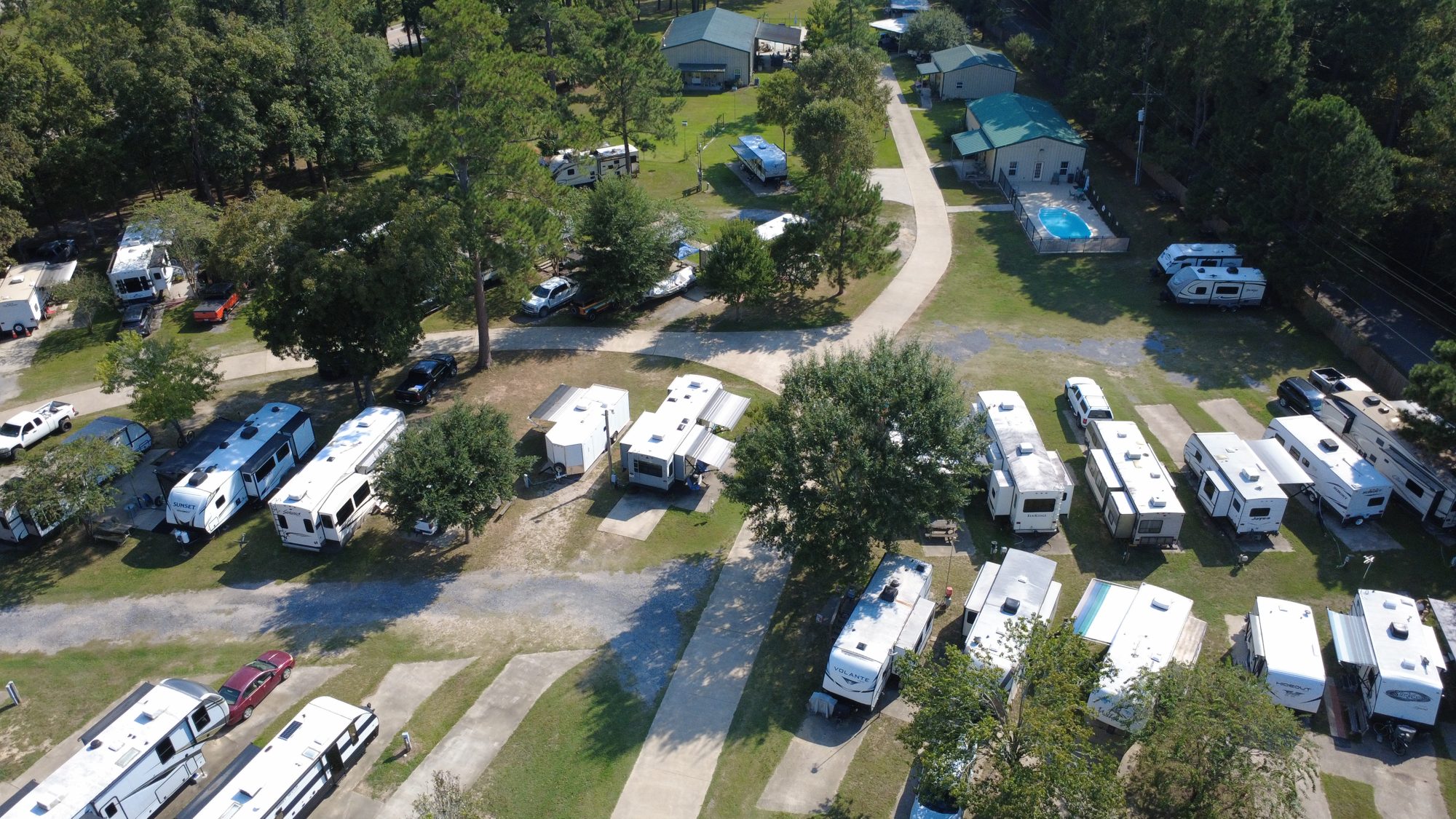 Aerial of RV sites along the park road under the trees